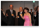 U.S. Ambassador Mr. Roos, Mr. Akashi, and Ms. Ohtani made a toast.